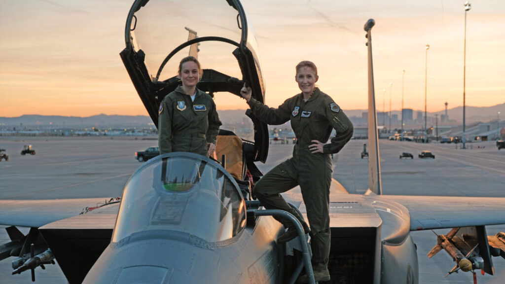 BRIE LARSON GETS HANDS-ON HELP FROM BRIG. GEN. JEANNIE LEAVITT, 57TH WING COMMANDER, ON A TRIP TO NELLIS AIR FORCE BASE IN NEVADA TO RESEARCH HER CHARACTER, FOR THE FILM, “CAPTAIN MARVEL.” PHOTO CREDIT: BRAD BARUH/MARVEL STUDIOS